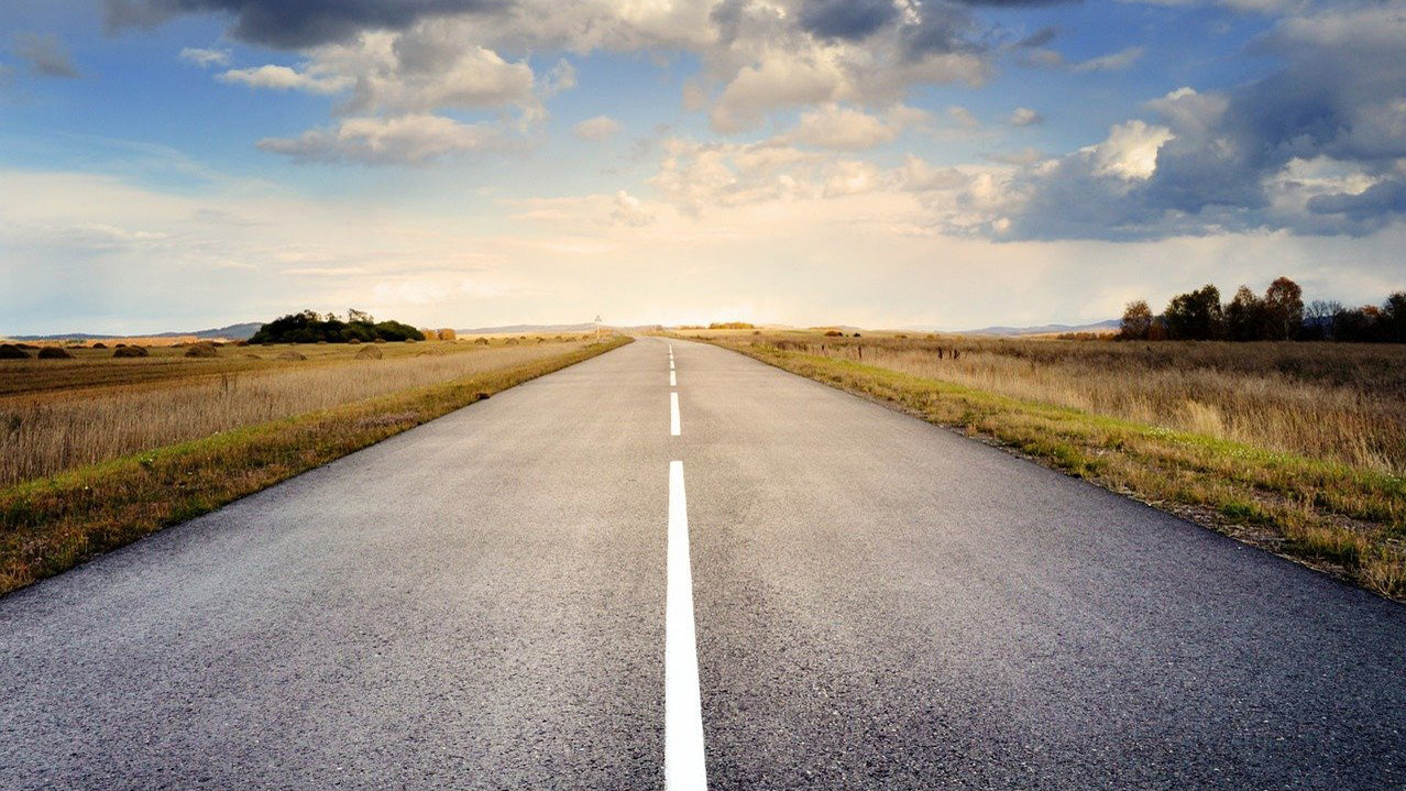 A straight road disappearing off to the horizon